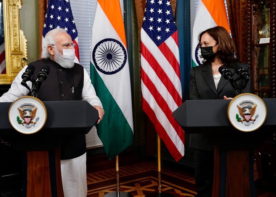 Narendra Modi and kamala harris looking eachother meme template