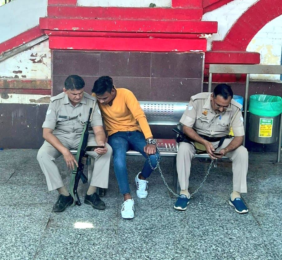 Criminal and officer watching on phone meme template